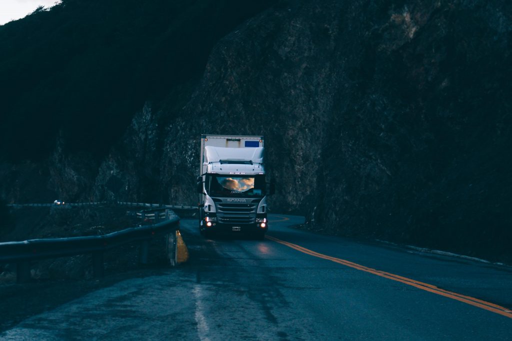 Scania Truck driving uphill in wet conditions