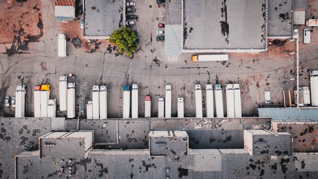 Overhead view of a busy truck stop depot